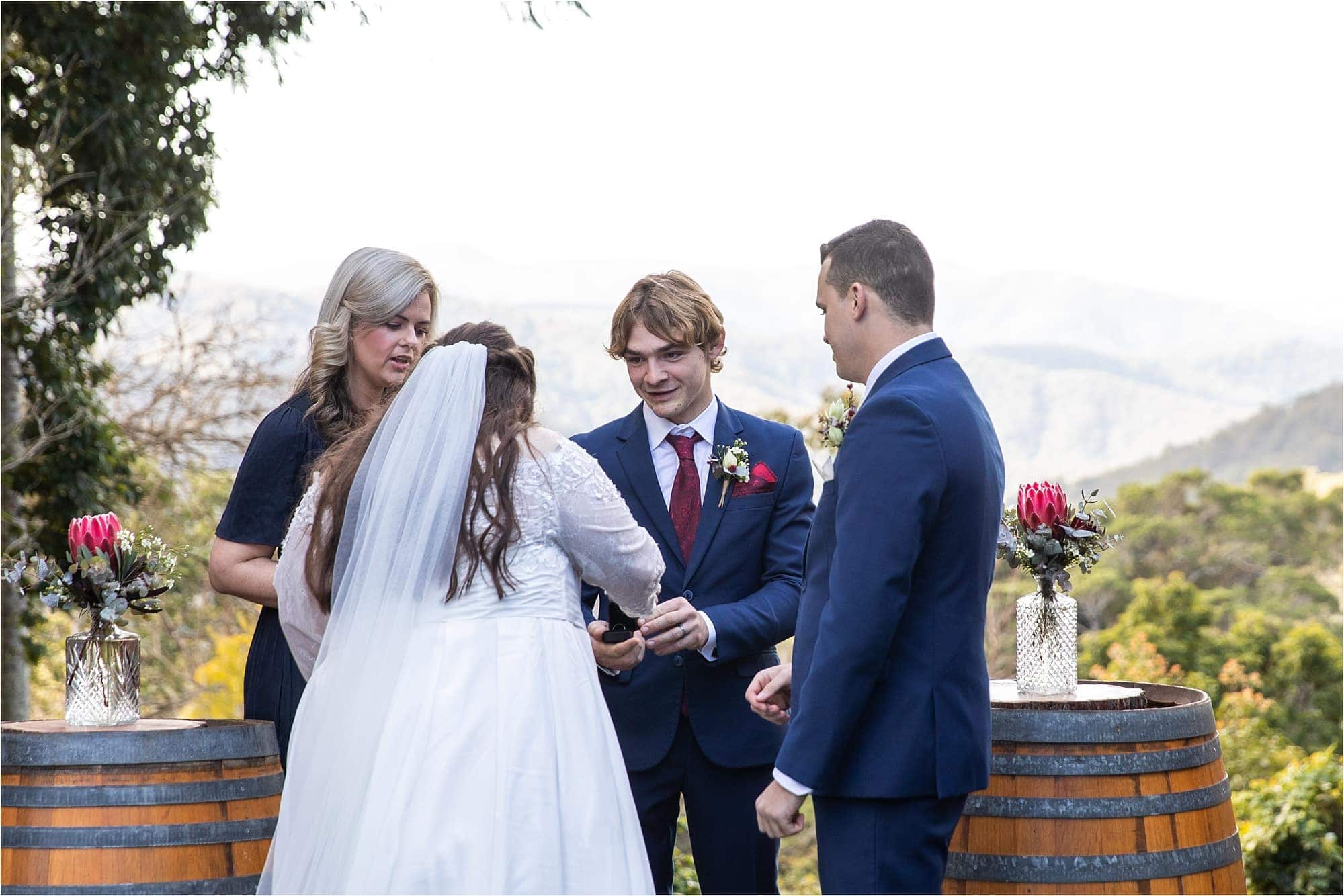 Tamborine Wedding photographer st bernards hotel weddings exchanging rings in a wedding ceremony