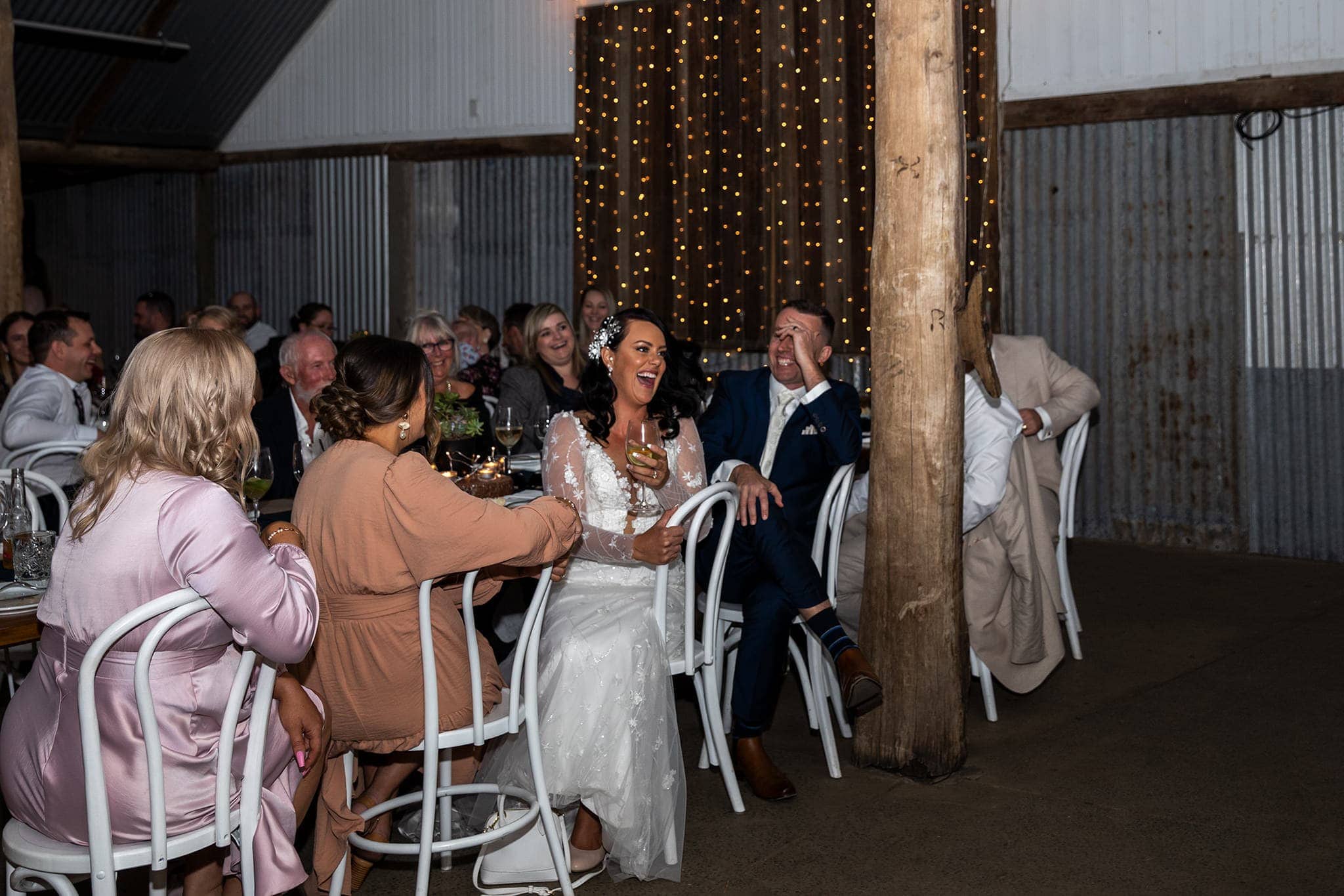 Bridal couple sit at their reception with their guests, The Acre Boomerang Farm Gold Coast