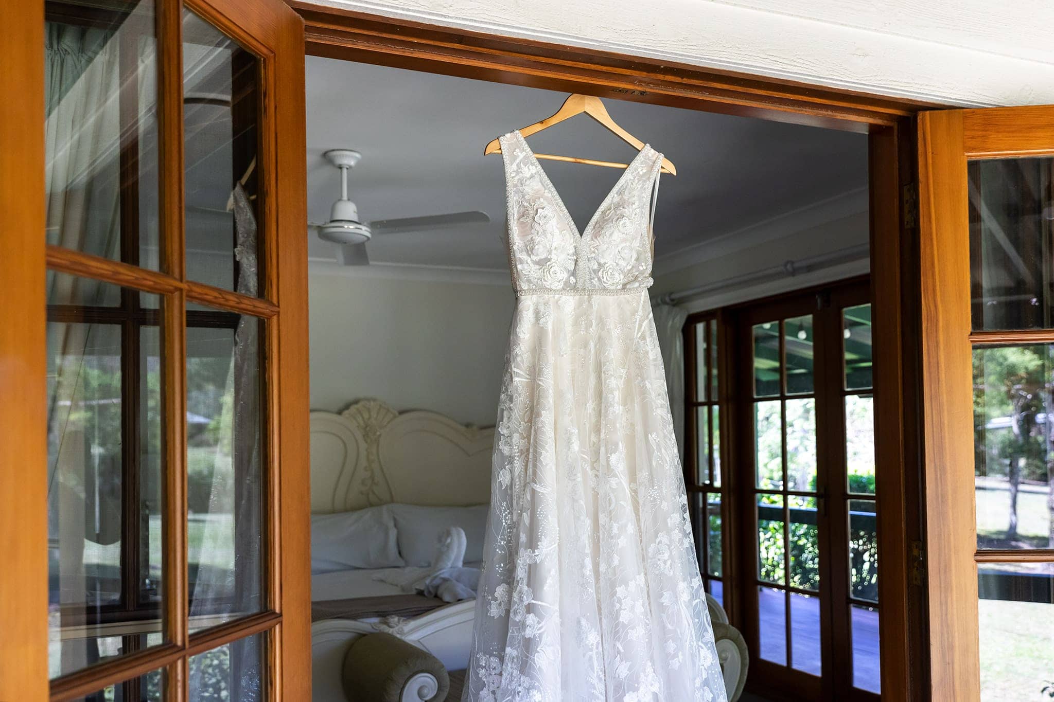 Brides dress hanging at Coolibah Downs Wedding Estate.