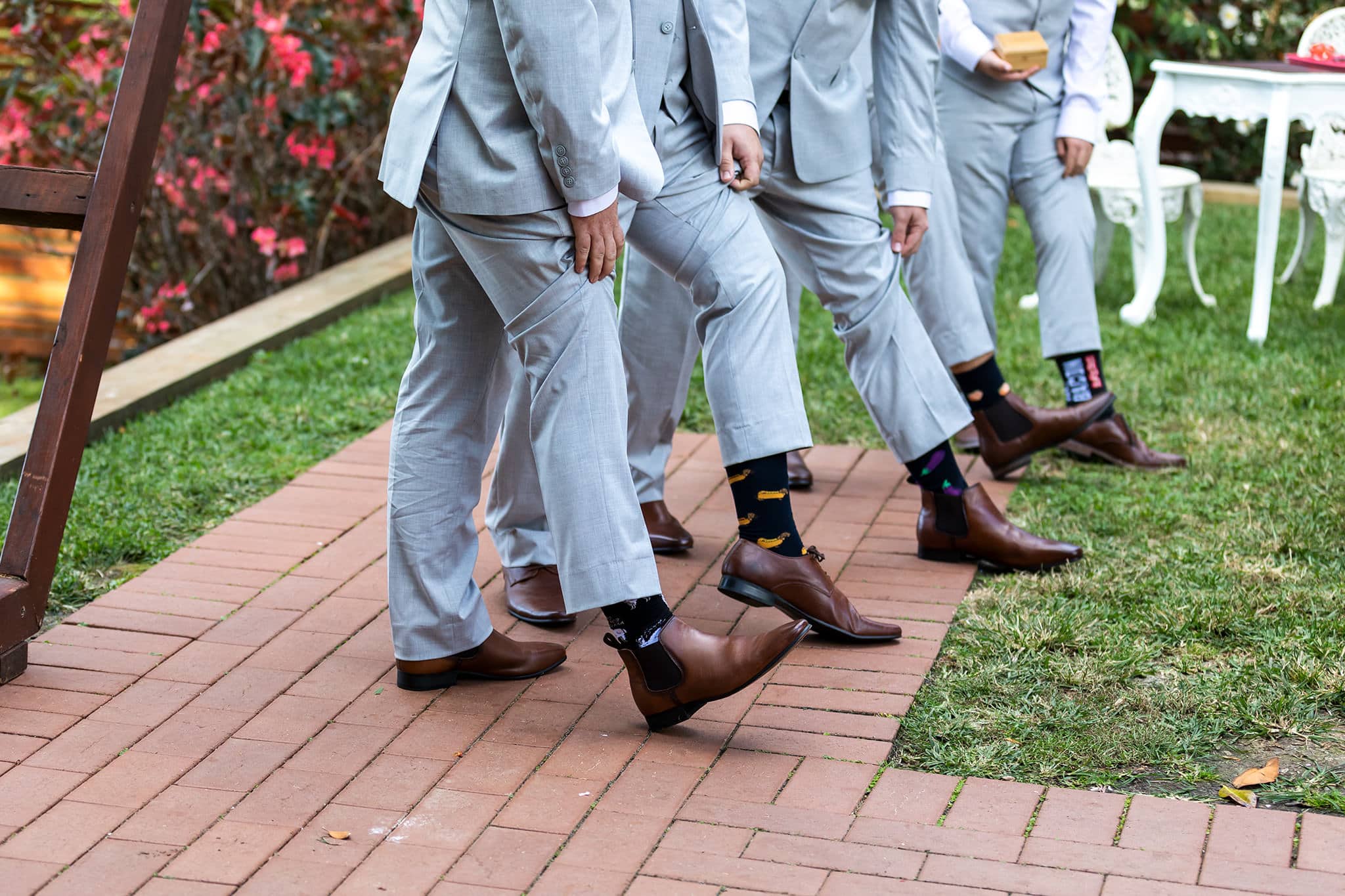 Groom and groomsmen showing their trendy socks.