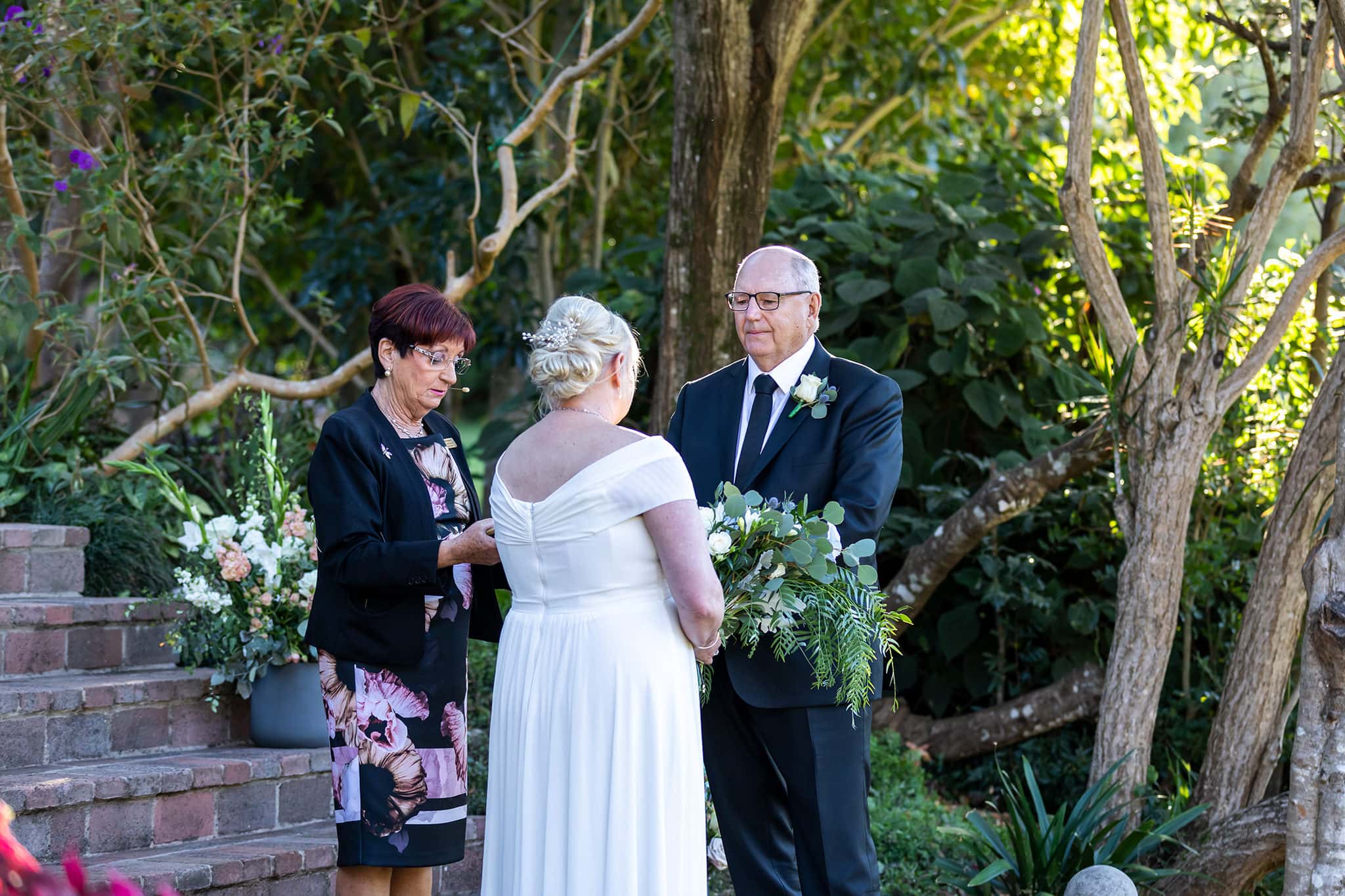 A wedding ceremony at The Secret Garden Estate, Tamborine Mountain by Mooi Photography.