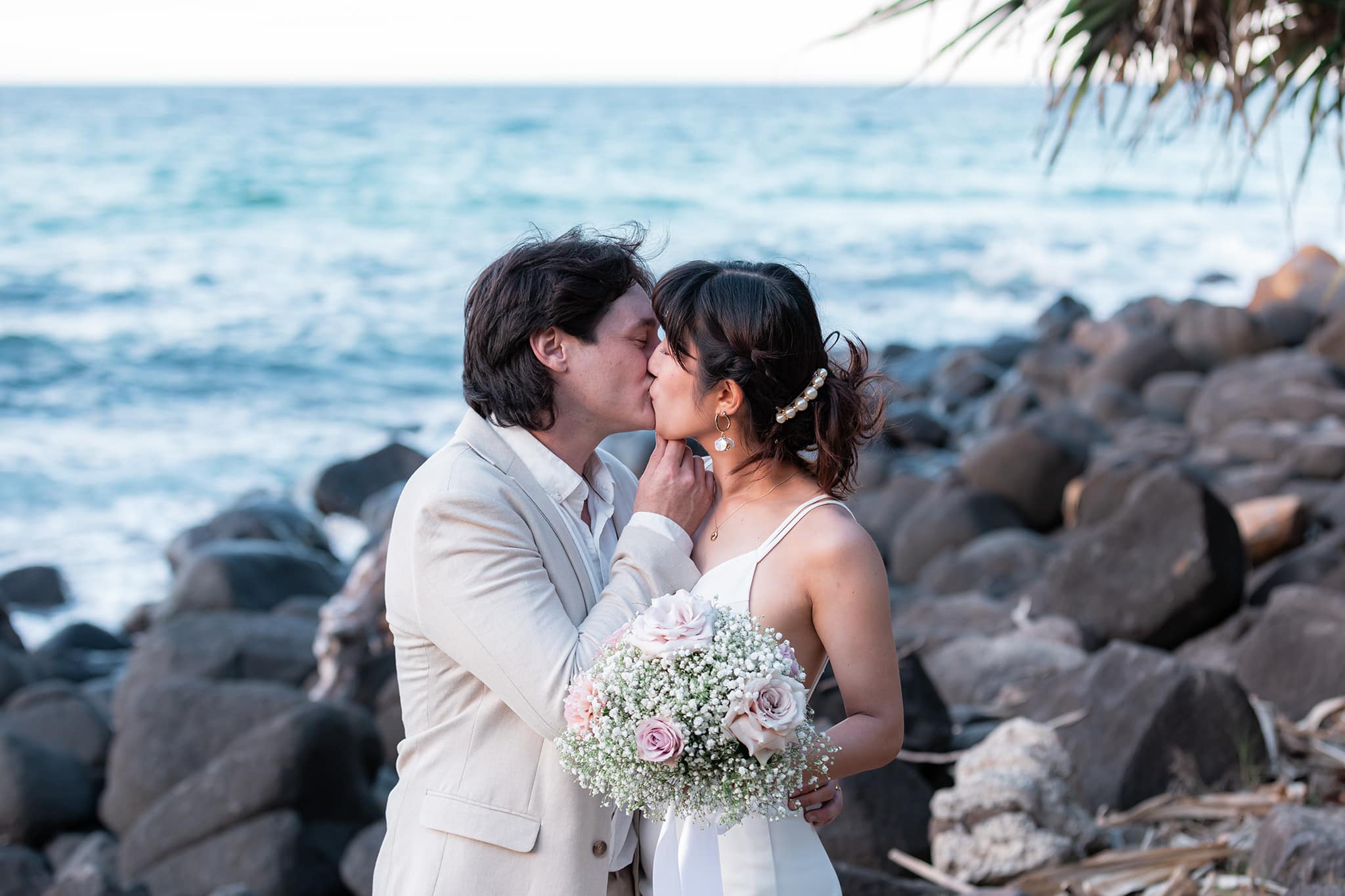 Bride and groom celebrating their wedding at Burleigh Heads on the Gold Coast.