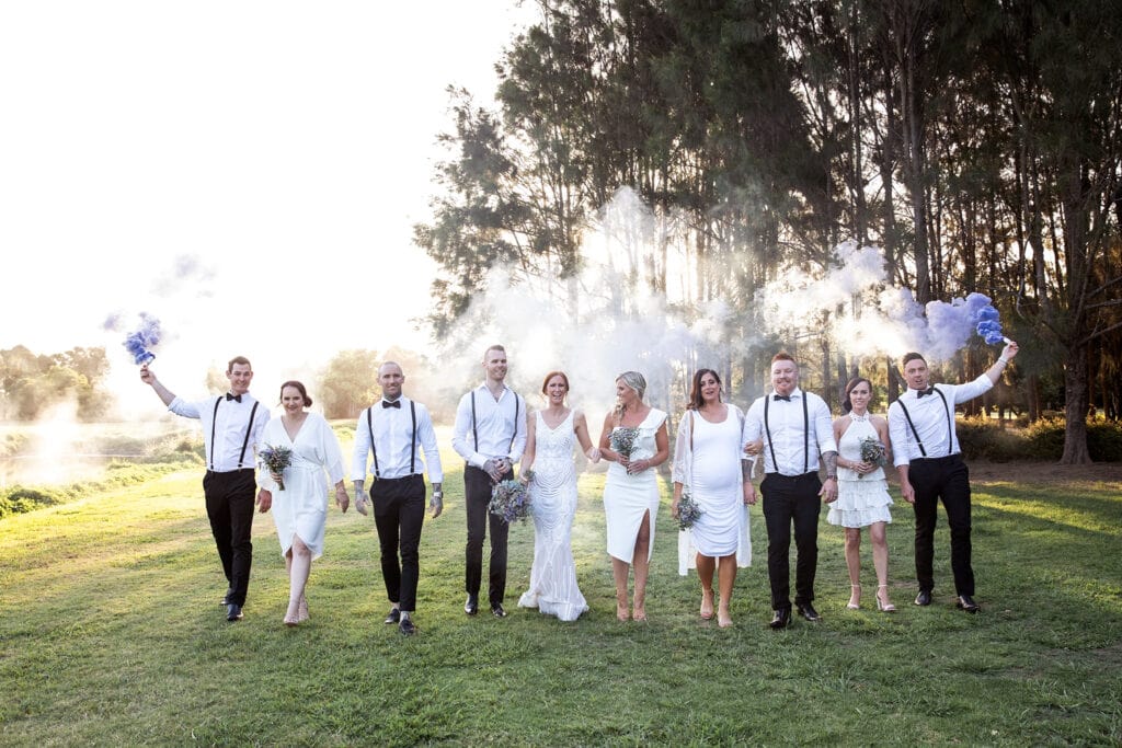 Bridal party with coloured smoke.
