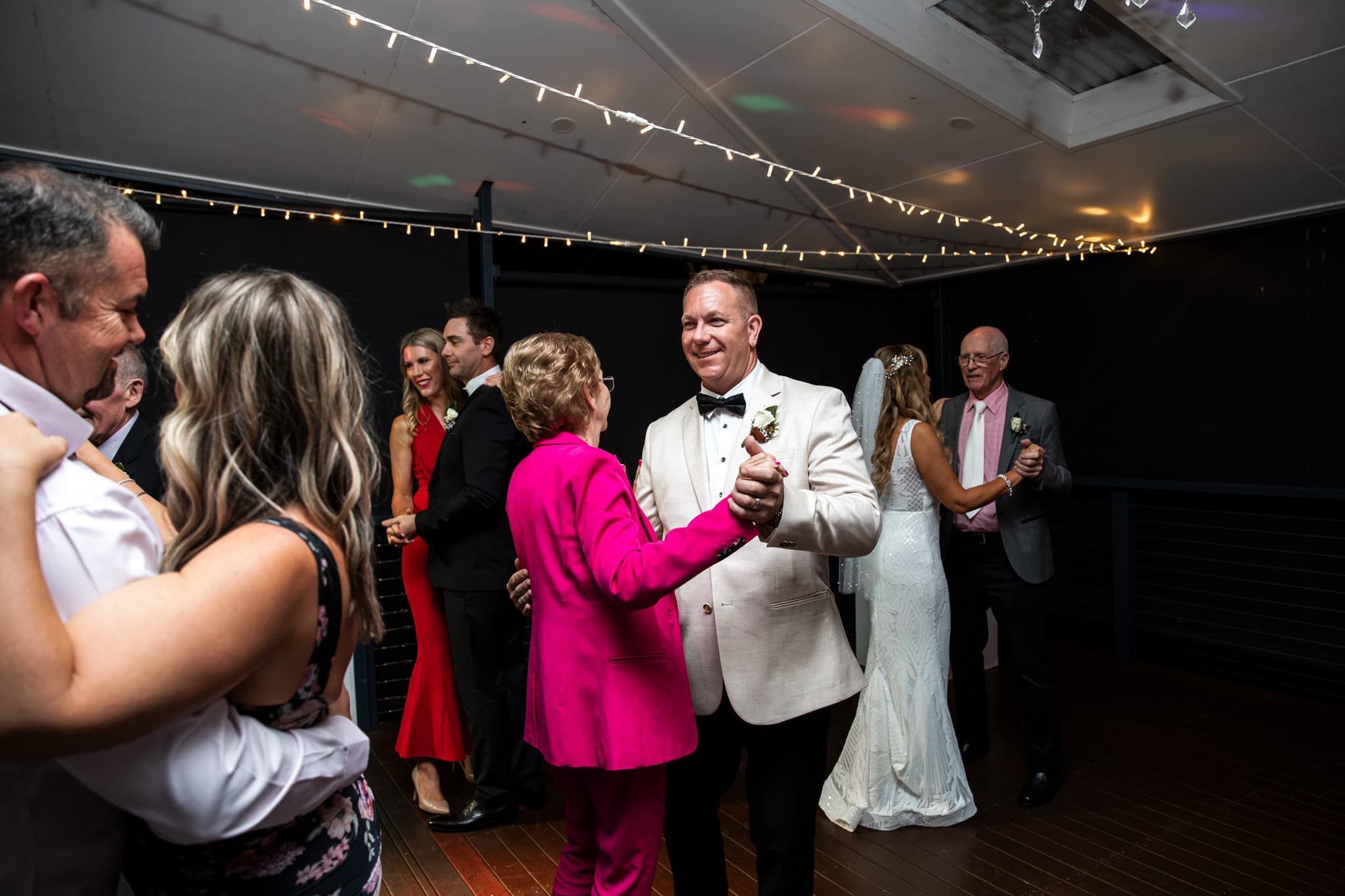 Wedding couple dancing at the reception photos at The Secret Garden Estate, Tamborine Mountain.